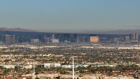 Aerial-Reveal-of-Las-Vegas-Strip-During-the-Day-from-Rocky-Desert-Landscape