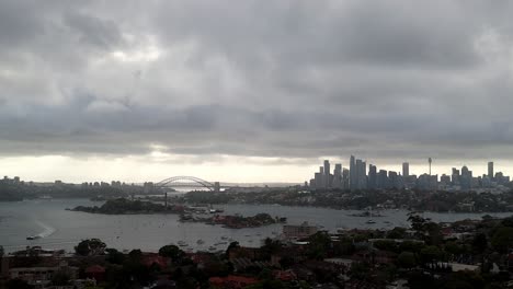 Overcast-Skyline-View-of-a-Metropolitan-City-with-Iconic-Bridge-and-Tower:-A-Blend-of-Urban-Architecture-and-Gloomy-Weather