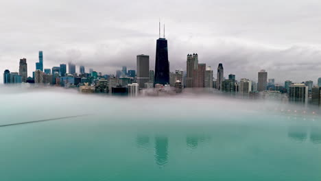 Aerial-view-around-the-foggy-lakefront-of-Streeterville,-cloudy-day-in-Chicago