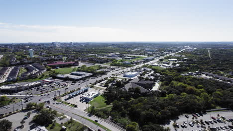Aerial-shot-over-Huebner-Road-in-San-Antonio,-Texas,-traffic,-dolly-forwards