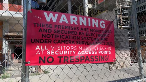 warning-sign-on-fence-