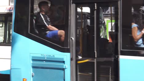 Closeup-Shot-Passengers-Traveling-inside-City-Bus-Public-Transportation-Autobus-People-Sitting