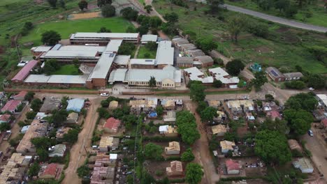 Drone-video-of-a-catholic-mission-school-campus-at-a-high-density-suburb-township-in-Bulawayo,-Zimbabwe