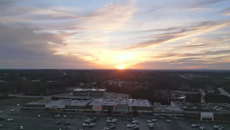 Aerial-wide-shot-of-North-Georgia-Cumming-during-golden-sunset-at-horizon,-USA,-Georgia