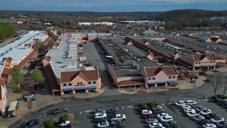 Aerial-orbiting-shot-showing-large-shopping-mall-near-highway-in-Dawsonville,-Georgia