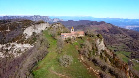 Drone-shot-Catholic-Church-on-mountain-with-beautiful-views-of-nature