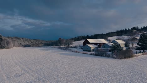 Countryside-Farmland-And-Structures-In-Deep-Snow-Landscape-Near-Indre-Fosen,-Trondelag-County,-Norway