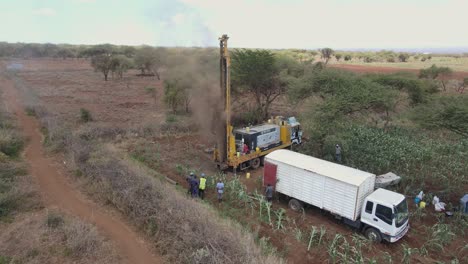 Aerial-view-of-engineers-drilling-bore-well-to-supply-African-village-with-drinkable-water