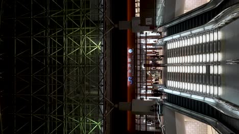 Stairs-Leading-To-East-Entrance-To-JR-Kanazawa-Station-At-Night-With-Commuters-Walking-Through-Concourse