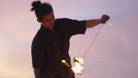 Sunset-Fire-Dance-Performance-with-Spinning-Flames-with-fire-Poi-2