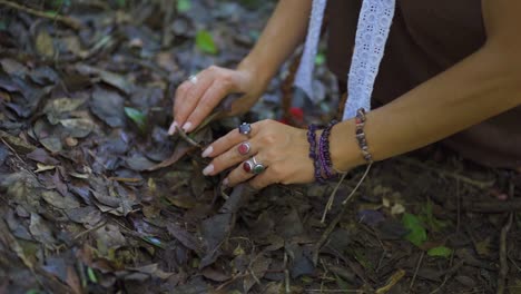 Beautiful-woman-caressing-and-holding-the-earth-and-the-leaves-of-the-trees-with-her-hands,-connecting,-embracing-and-loving-the-nature-of-the-planet