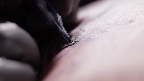 Tattoo-Artist-Hand-In-Gloves-During-Tattooing-Procedure