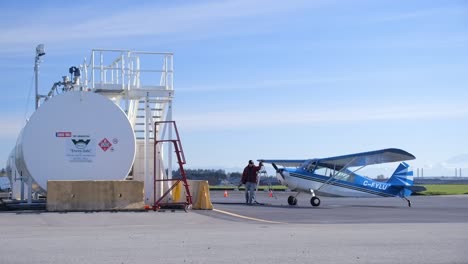 Pilot-Fueling-Taildragger-Airplane-at-Airport-Fuel-Station-SLOMO
