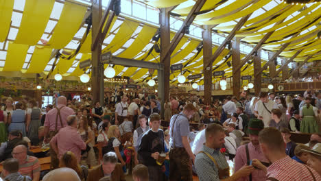 People-in-Oktoberfest-Beer-Tent-during-Annual-Celebrations-in-Munich,-Bavaria