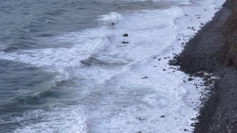 Tilt-up-shot-of-atlantic-ocean-with-big-waves-near-Azores---Drone-shot