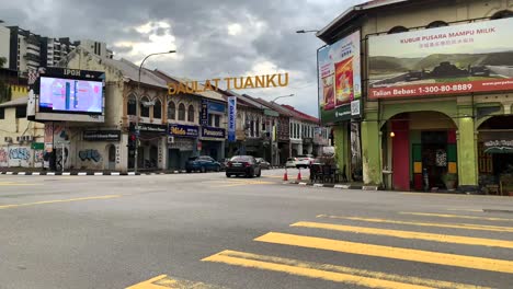 A-street-view-in-the-city-center-of-Ipoh-Malaysia-with-cars,-pedestrian-lanes,s-and-commercial-building