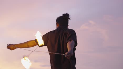 Sunset-Fire-Dance-Performance-with-Spinning-Flames-with-fire-Poi-1
