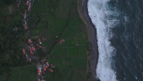 Top-down-view-of-Flores-island-with-rough-ocean,-aerial