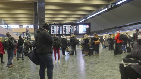 Commuters-at-Euston-Station-gathering-information-about-their-journeys