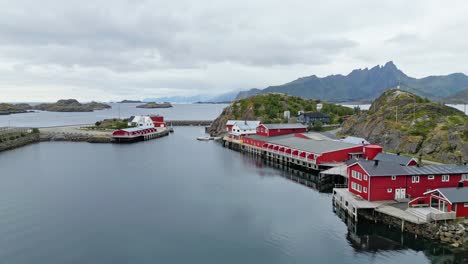 Lofoten-Islands-Fishing-Factory-and-Red-Cabins-in-Mortsund,-Norway---Aerial-4k