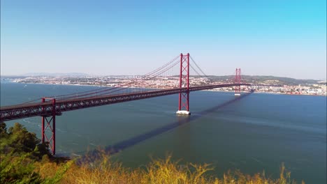 Long-exposure-timelapse-about-the-traffic-on-the-25-de-Abril-Bridge-and-Lisbon,-Portugal