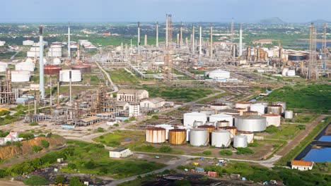 Aerial-trucking-pan-establishes-flare-stacks-and-oil-refinery-storage-tanks