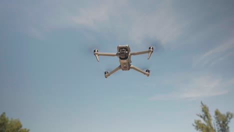 Drone-with-gimbal-stabilization-hover-in-air-and-rapidly-ascend,-disappear