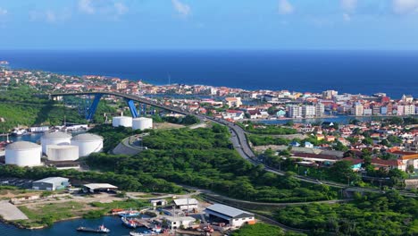 Aerial-orbit-around-Queen-Juliana-Bridge-with-coastal-views-of-Willemstad-Curacao