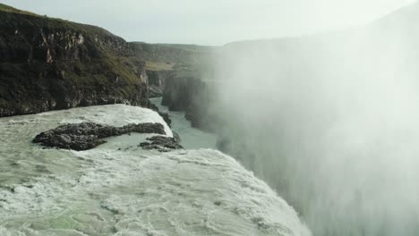 Gullfoss-iceland,-famous-golden-waterfall,-water-fog-steam-rising,flowing-between-rock-hvita-canyon