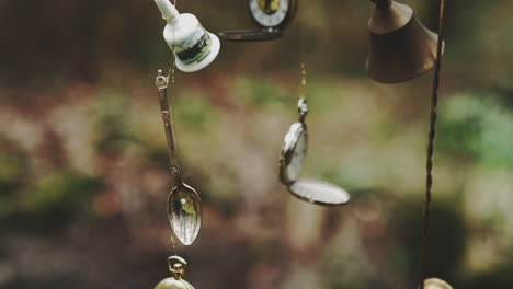 Pocket-watches-and-bells-hanging-in-art-installation