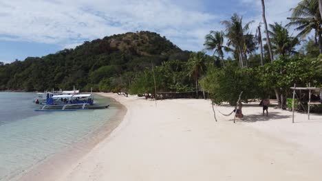 Island-hopping-tourism-at-tropical-Coco-beach-of-Bulalacao,-Coron