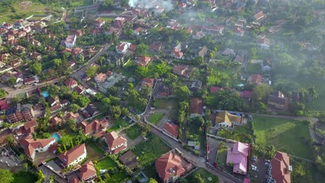 Smoke-Rising-In-The-Air-In-Bukasa-Neighbourhood-In-Kampala,-Uganda