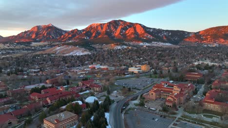Drone-flying-over-the-University-of-Colorado-Boulder-at-sunset-on-a-winter-morning