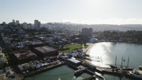 Aerial-view-toward-the-Aquatic-Cove-beach,-in-sunny-San-Francisco,-USA