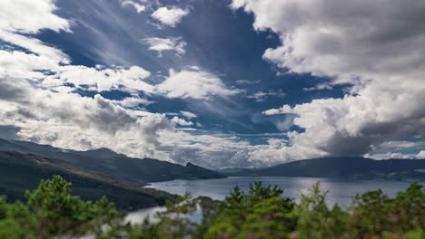 White-clouds-whirl-and-flow,-carried-by-the-strong-wind,-above-the-Hardanger