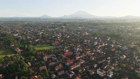 Establishing-scene-shot-of-cultural-town-called-Ubud-with-the-view-at-volcano-Agung-at-the-background-during-sunrise