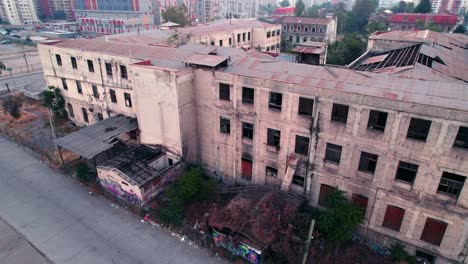 Aerial-Panoramic-Drone-Fly-Above-Abandoned-Ruined-Large-Building-Old-Hospital-in-Town
