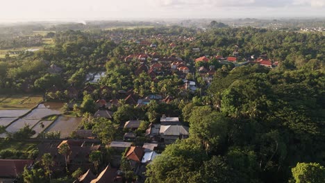 Cinematic-sunrise-view-of-Ubud-town-famous-for-traditional-crafts-with-Monkey-Forest-at-foreground