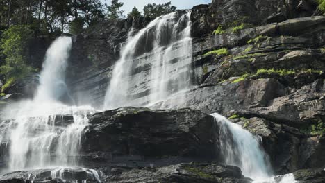 A-magnificent-Tvindefossen-waterfall-in-summer