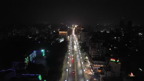 Rajkot-aerial-drone-view-Buildings-are-visible-around-the-road,-a-lot-of-traffic-is-visible-on-the-road