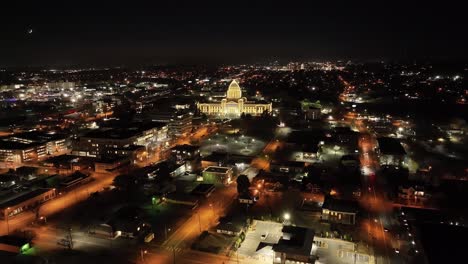 Arkansas-State-Capitol-building-at-night-in-Little-Rock,-Arkansas-with-drone-video-wide-shot-moving-in-at-an-angle