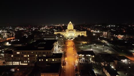 Arkansas-State-Capitol-building-at-night-in-Little-Rock,-Arkansas-with-drone-video-pulling-back