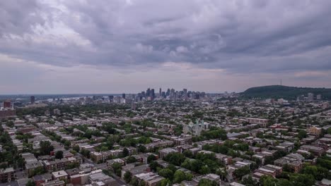 Overcast-cityscape-with-a-distant-view-of-downtown-skyscrapers,-set-against-a-moody-sky,-from-a-drone