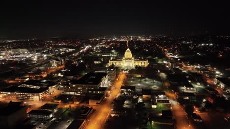 Arkansas-State-Capitol-building-at-night-in-Little-Rock,-Arkansas-with-drone-video-moving-in-a-circle-wide-shot