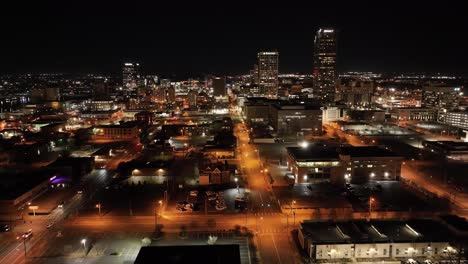 Little-Rock,-Arkansas-downtown-skyline-at-night-with-drone-video-moving-in