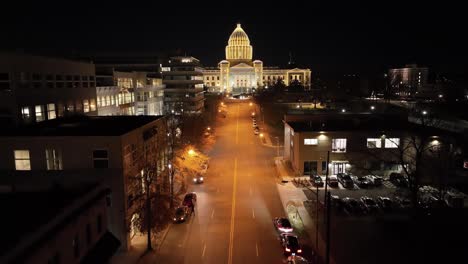 Arkansas-State-Capitol-building-at-night-in-Little-Rock,-Arkansas-with-drone-video-moving-up-close-up