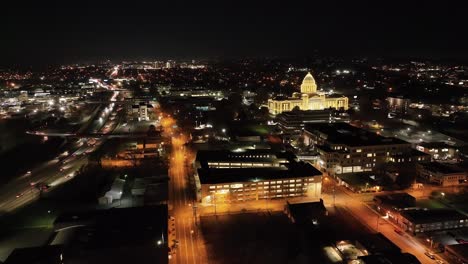 Arkansas-State-Capitol-building-at-night-in-Little-Rock,-Arkansas-with-drone-video-moving-down-wide-shot