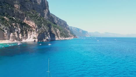 Cala-Goloritze-and-Boating-tourism-at-Orosei-Gulf,-Sardinia