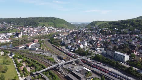 Footbridge-over-Railway-tracks-of-Bingen-train-station-in-Germany,-Aerial