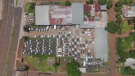 An-overhead-shot-of-a-car-dealership-in-Misiones,-Argentina-as-the-camera-moves-down